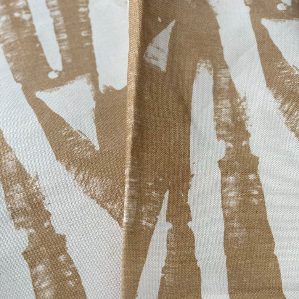 Close-up of fabric with abstract brown and white pattern