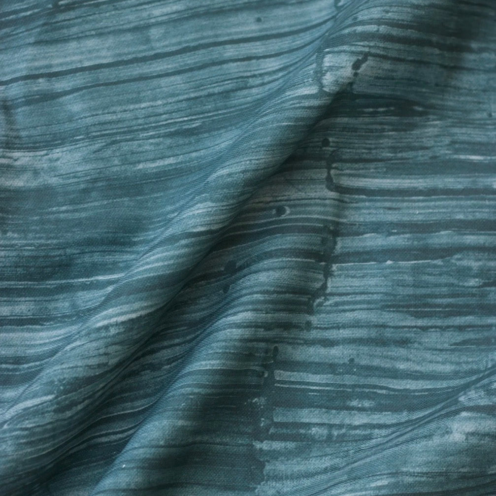 Close-up of textured blue fabric with wavy pattern