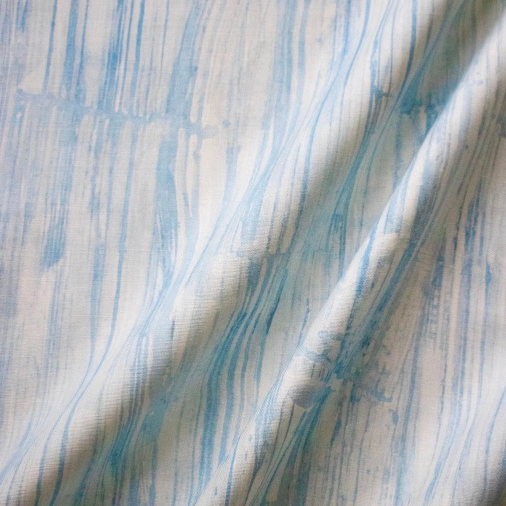 Close-up of fabric with blue and white abstract pattern