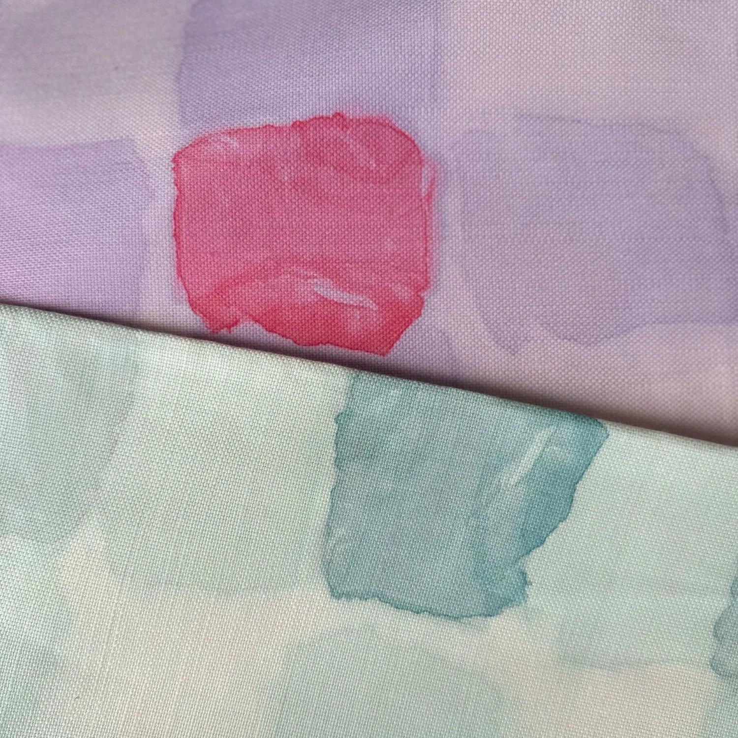 Close-up of fabric with pink and purple abstract pattern