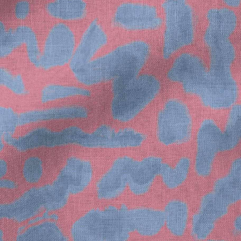 Textile with abstract blue pattern on a pink background