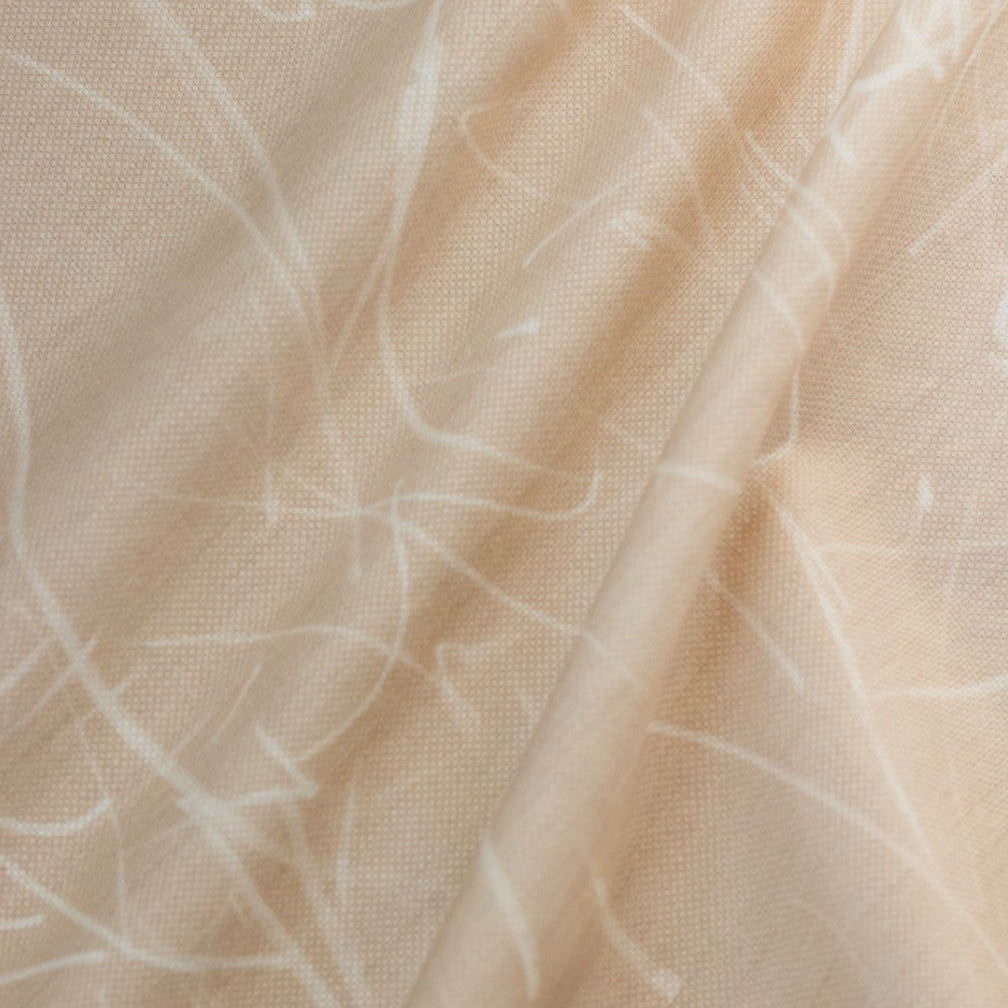 A fabric with a natural color base featuring a white, free-form, abstract pattern.